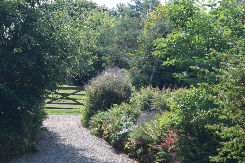 Photo Gallery Image - Gate to 1.5 acres of Garden at Badgers Sett Holiday Cottages 