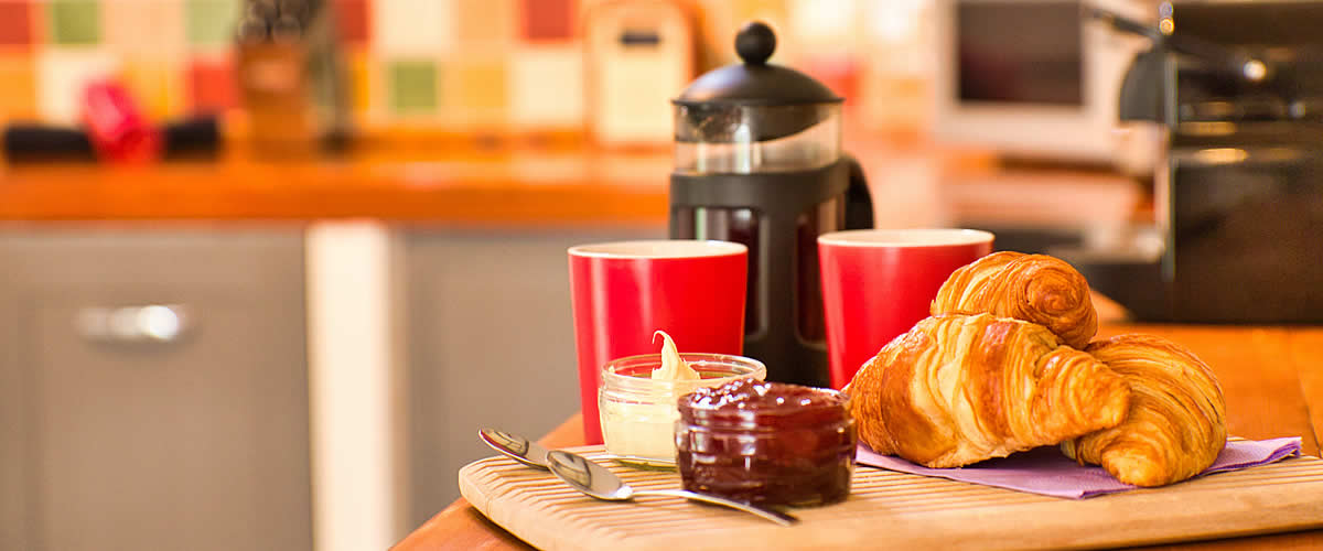 Coffee, jam and croissants