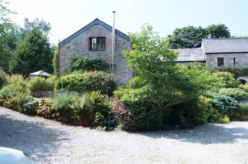 Photo Gallery Image - Lavender Cottage with it's striking stainless steel flue 