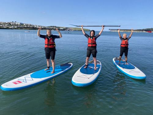Paddle Boarding at Harlyn Bay: Glide, Gaze, and Giggle!