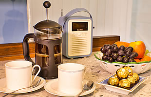 Coffee  with fruit and chocolates