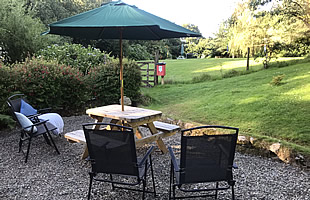 Patio with garden furniture at the rear of Lavender Cottage