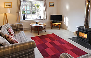 Lounge with comfortable settee and armchair