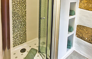 Bathroom with shower cubicle, washbasin and wc